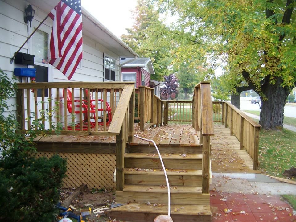 A wooden deck with stairs and an american flag