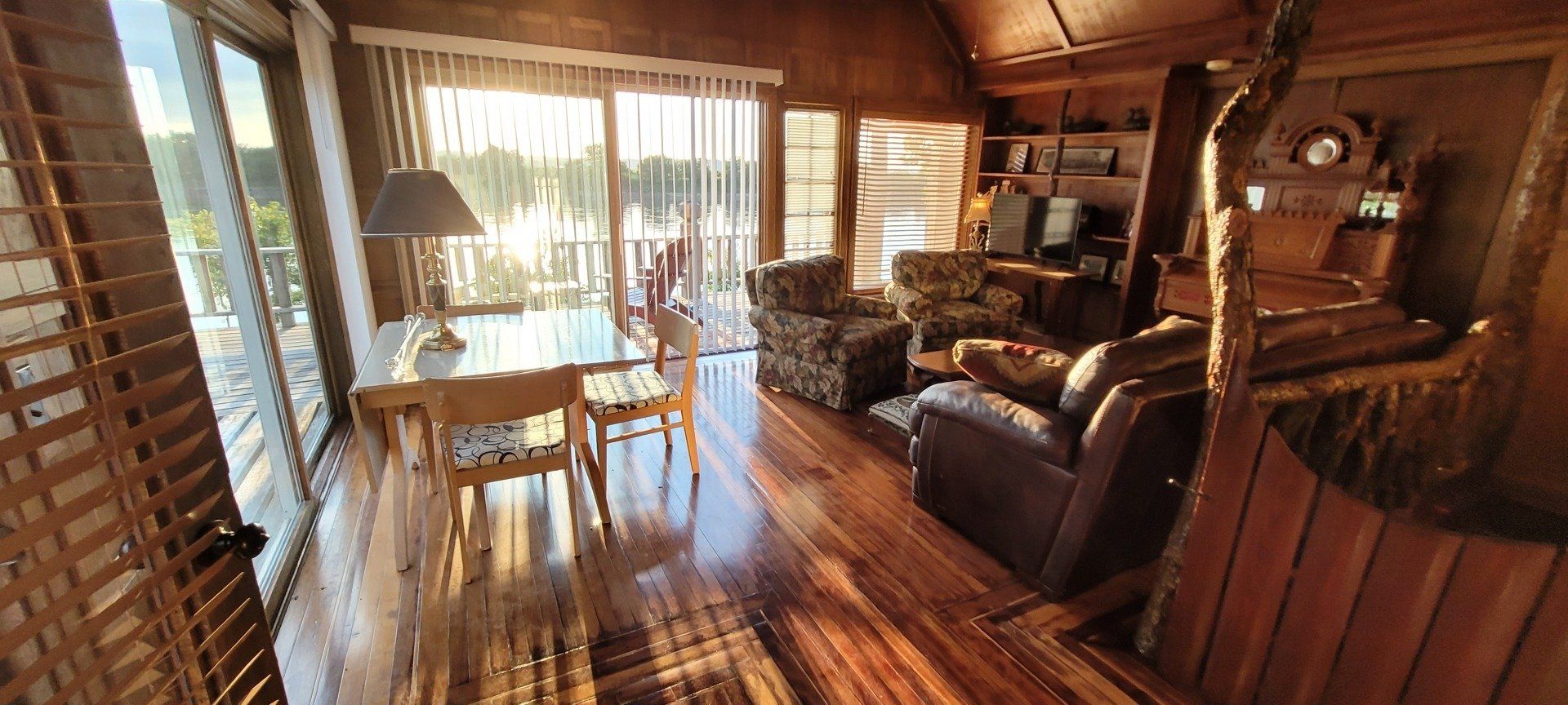 A living room filled with furniture and a large window.
