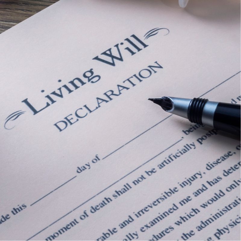 A living will with a pen on top of it