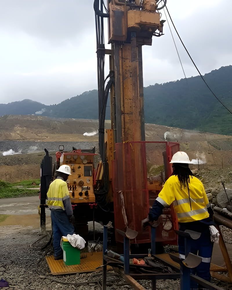 A Man In A Yellow Shirt Is Working On A Machine — PGI North QLD In Bowen, QLD