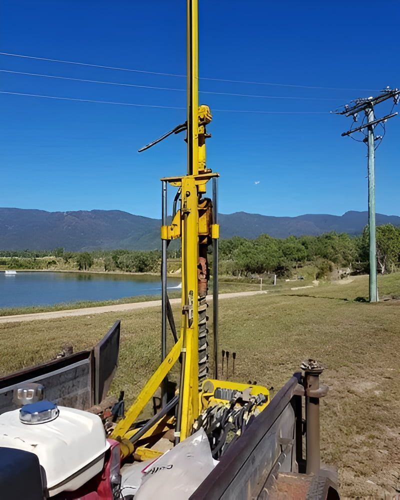 A Yellow Drill Is Sitting In The Back Of A Truck — PGI North QLD In Charters Towers, QLD