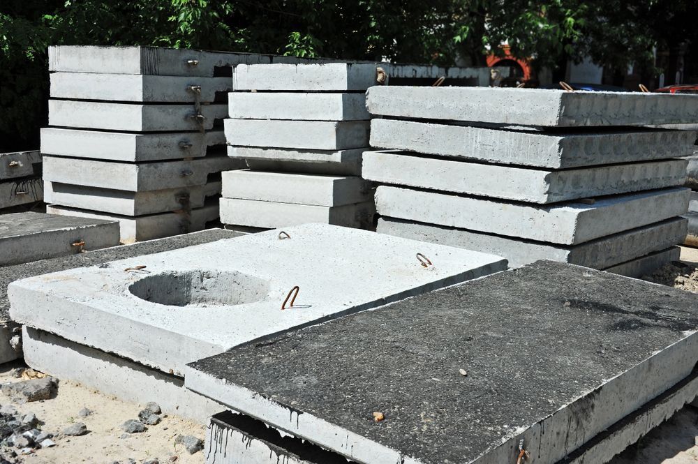A Pile Of Concrete Slabs With A Hole In The Middle — PGI North QLD In Rosslea, QLD