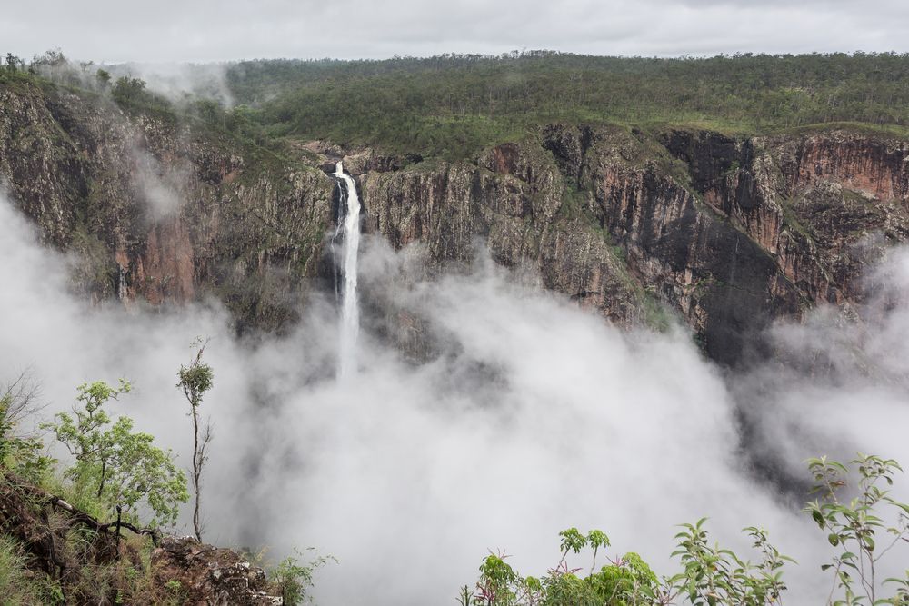A Waterfall Is Surrounded By Clouds In The Middle Of A Valley — PGI North QLD In Ingham, QLD
