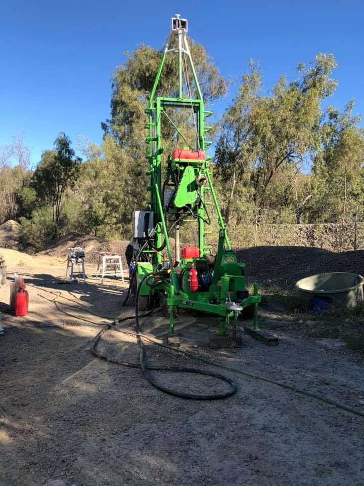 A Green Machine Is Sitting On Top Of A Dirt Field — PGI North QLD In Bowen, QLD