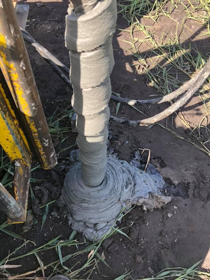 A Drill Bit Is Being Used To Drill A Hole In The Ground — PGI North QLD In Bowen, QLD