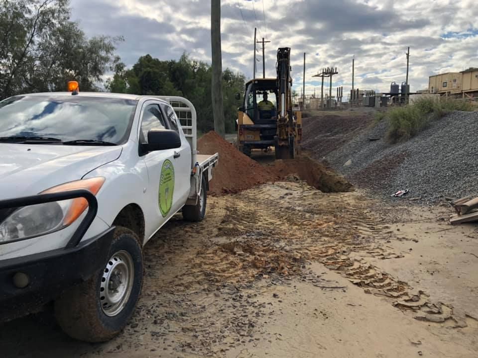 A White Truck Is Parked Next To A Pile Of Dirt — PGI North QLD In Rosslea, QLD