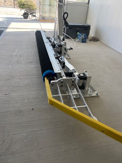 Building a carwash. Tire shine. Express car wash installation in San Antonio Texas for Kwik-n-Clean Car Wash with road runner logo