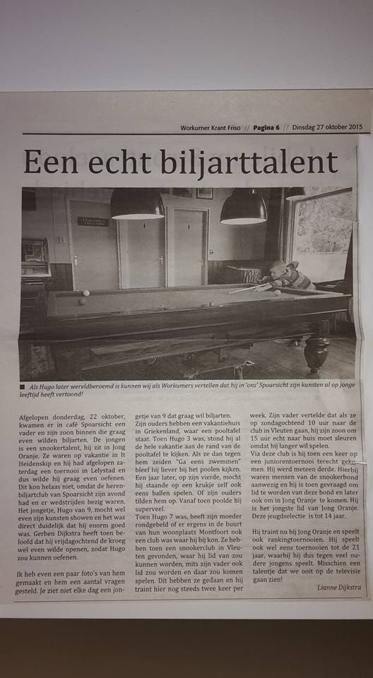 Newspaper clipping featuring a billiards room. Headline: