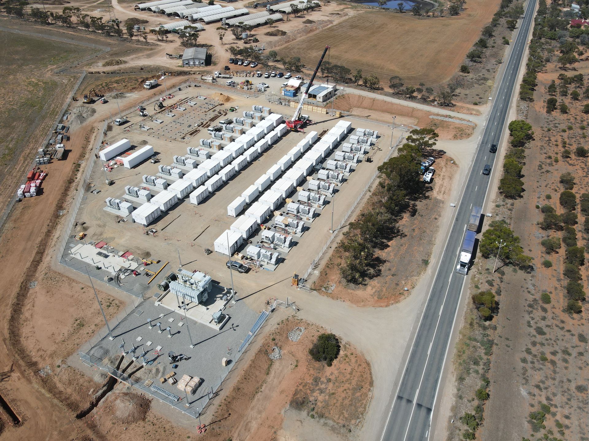 AGL & Son crane lifting heavy construction materials