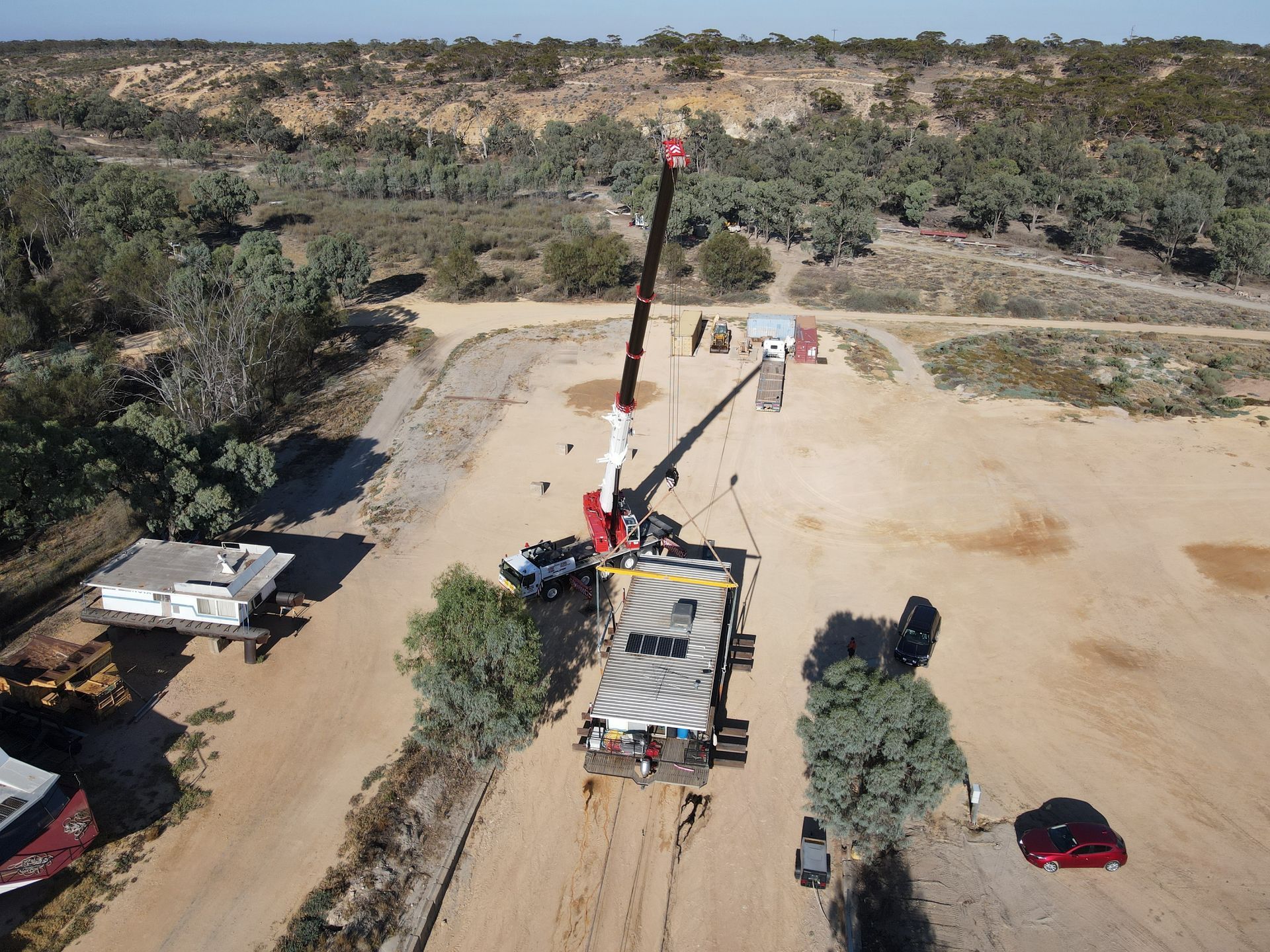 AGL & Son | Crane lifting a houseboat
