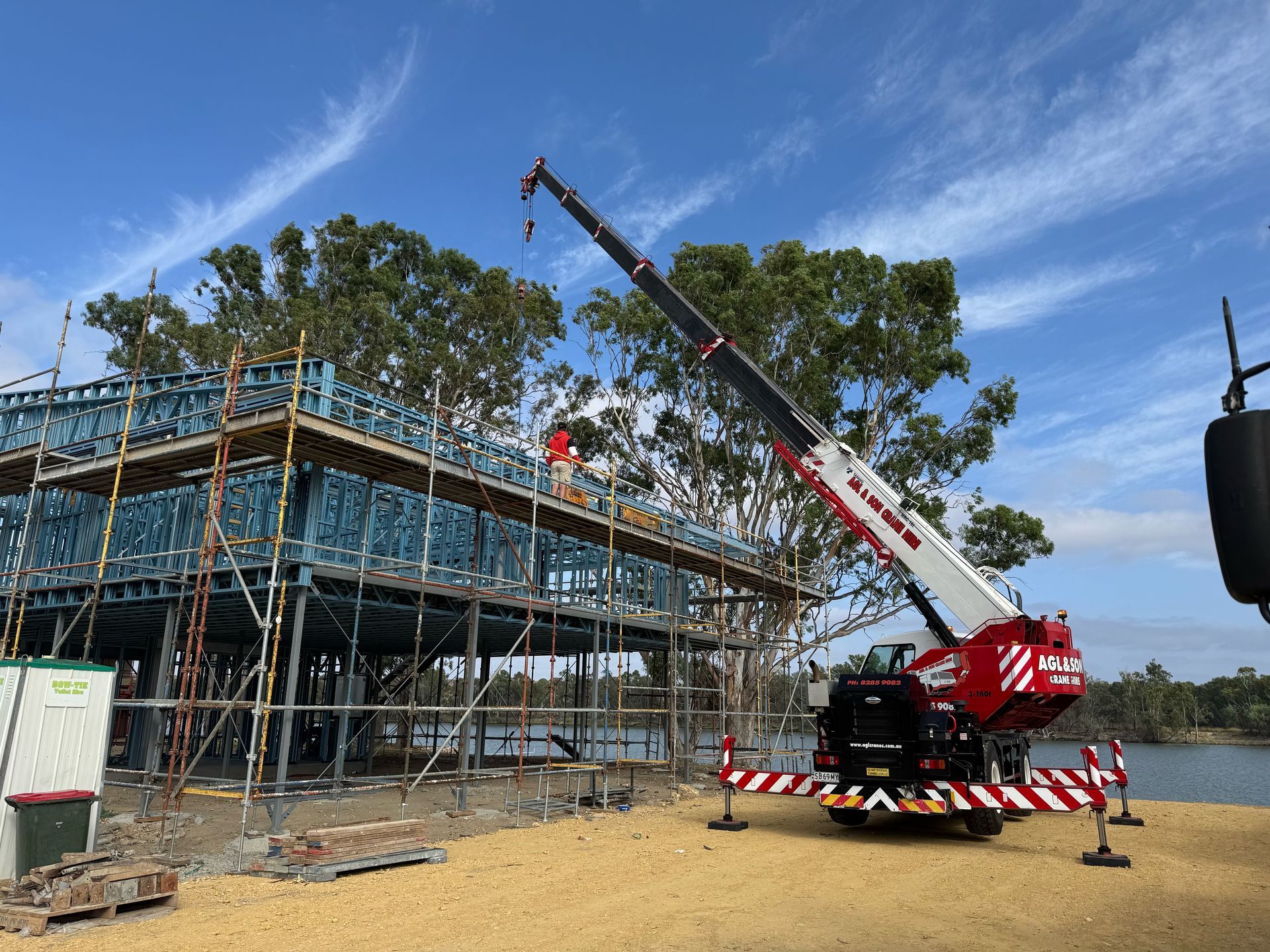 Crane operating on a building site by AGL & Son Crane Hire Crane operating on a building site by AGL & Son Crane Hire