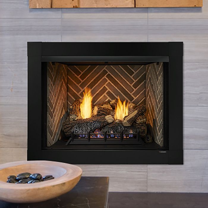 A fireplace with a bowl of rocks in front of it