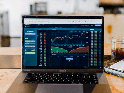 Laptop with a financial forecast graph