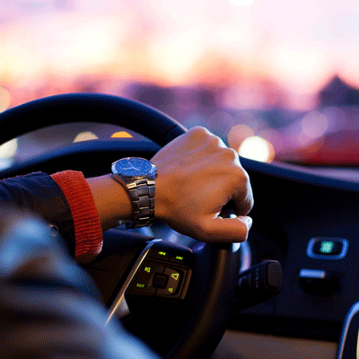 Hand on a steering wheel