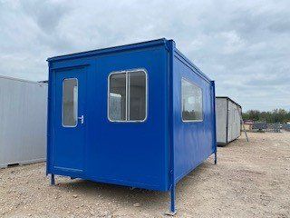 A blue modular building with a door