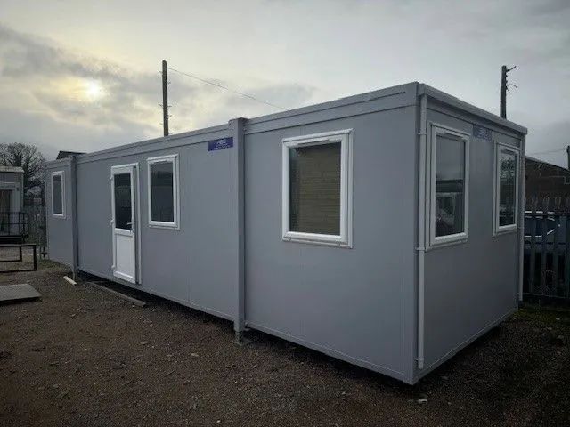 Portakabin with a window facing forward under grey skies