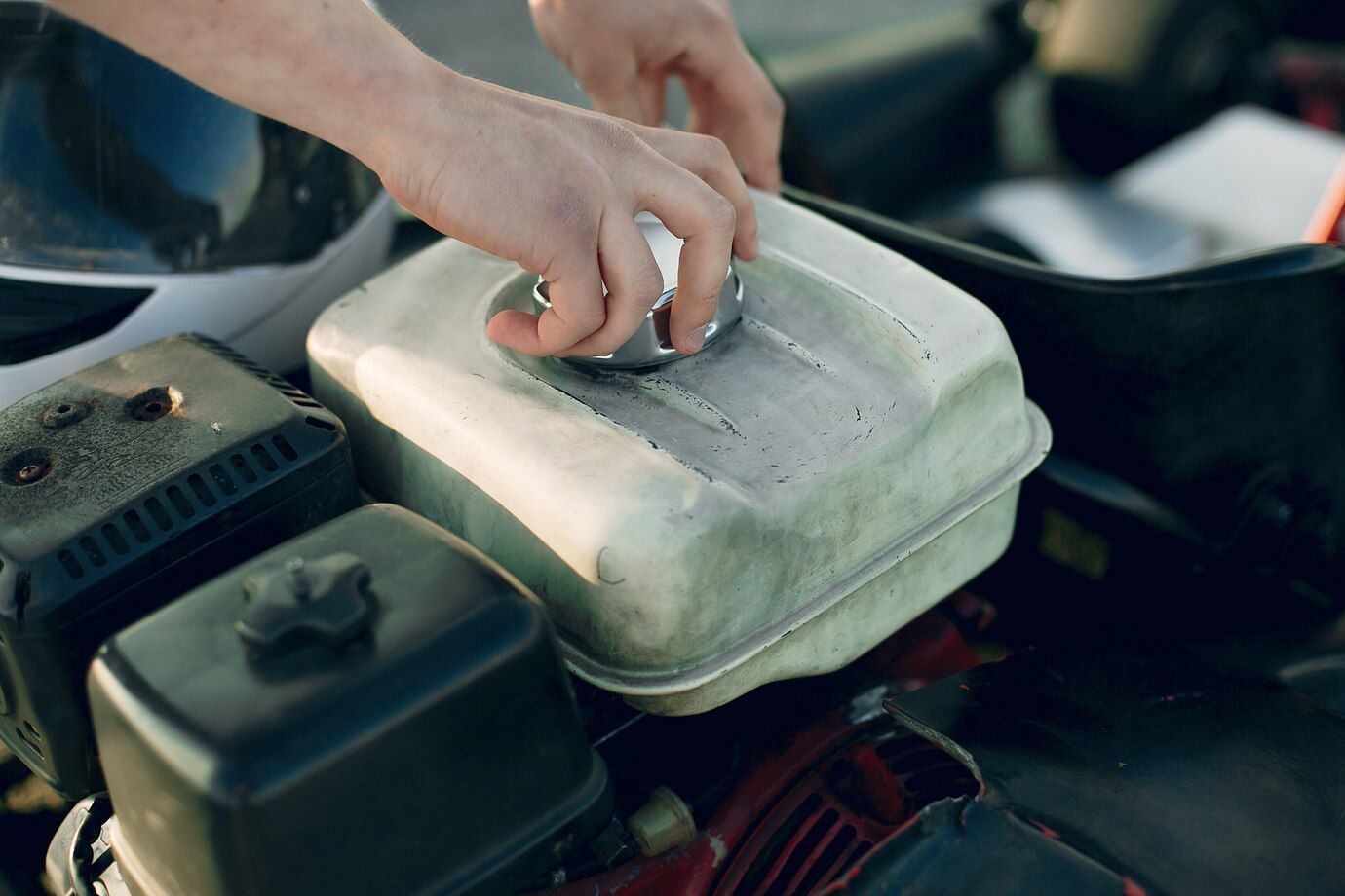 man repairing engine car