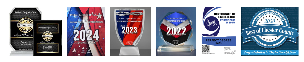 Assortment of awards and plaques, some displaying the years 2022 and 2024.