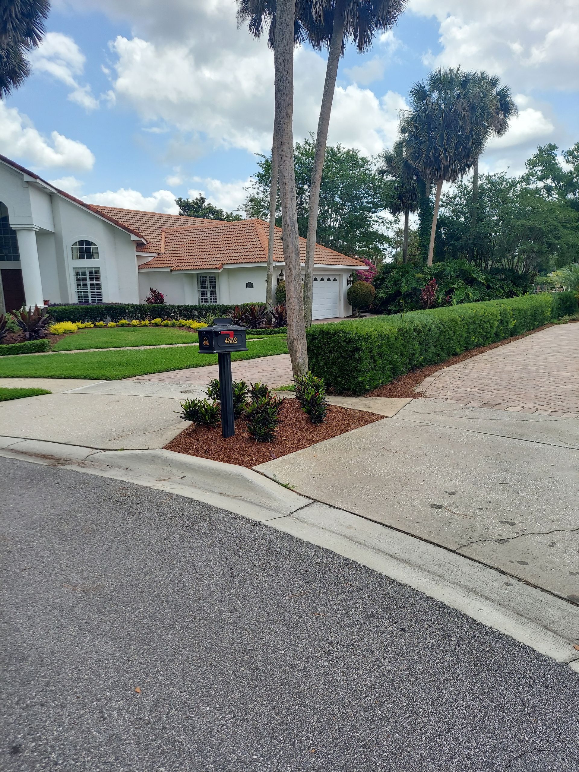 A house with a mailbox in front of it
