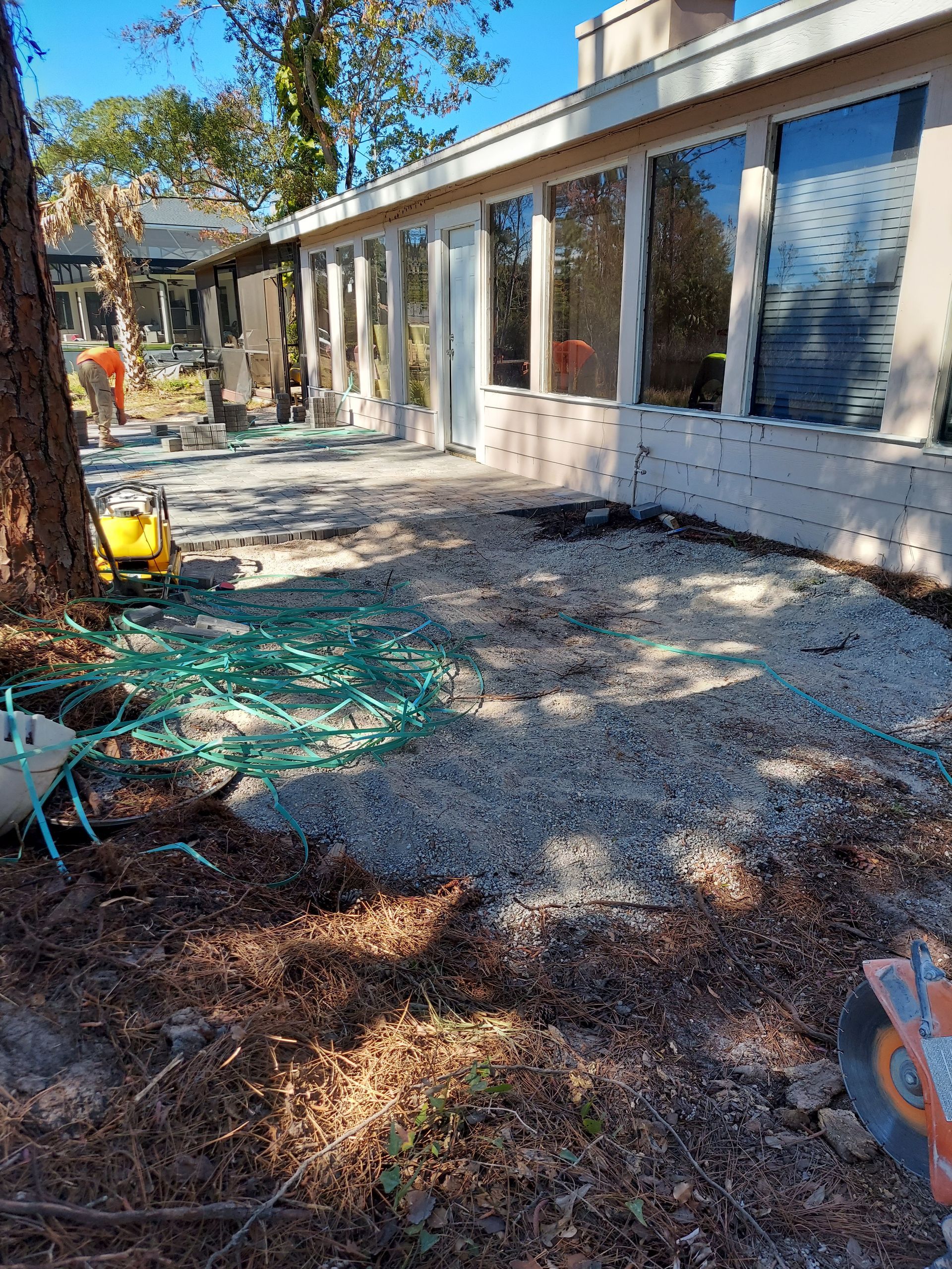A large house with a lot of windows is being remodeled.