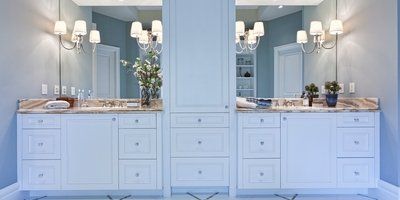 A bathroom with two sinks and two mirrors.
