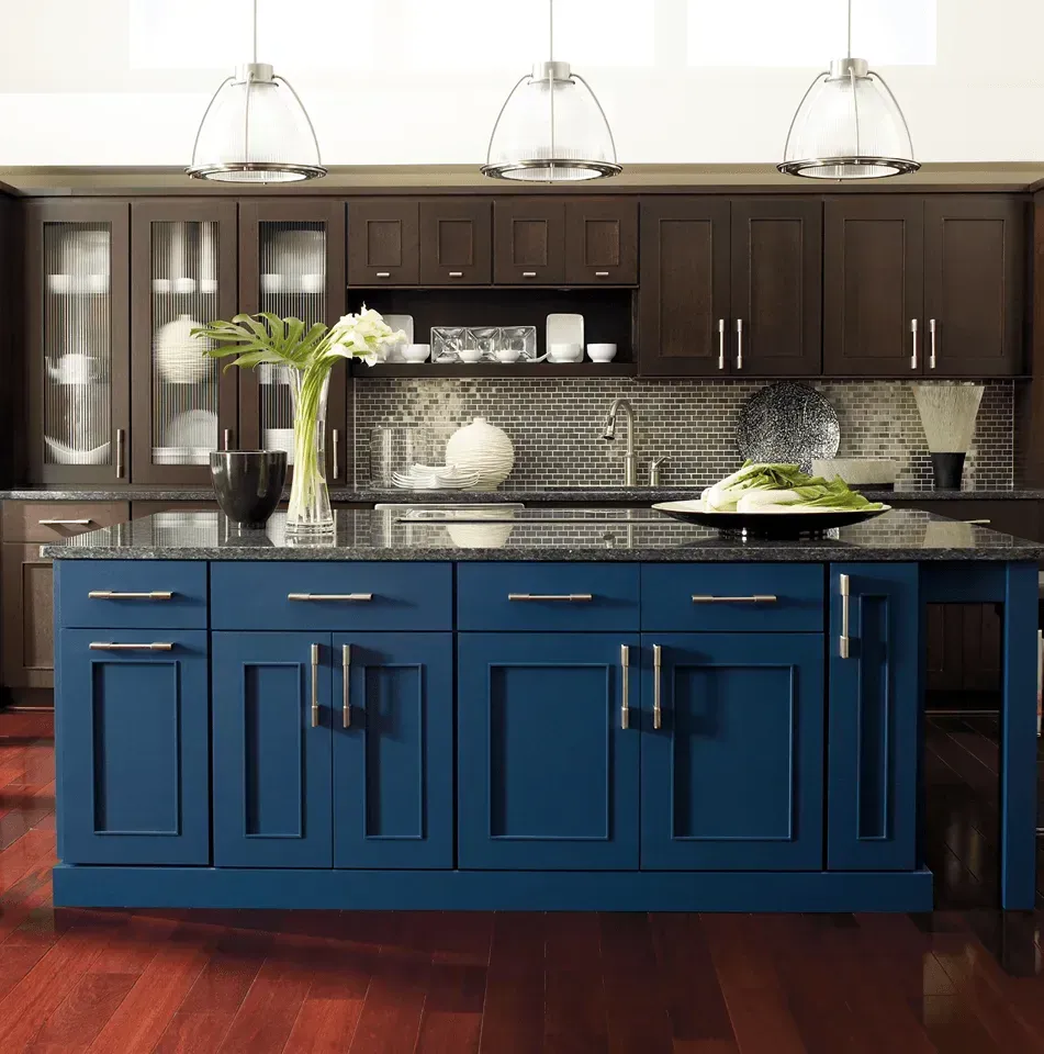 A kitchen with blue cabinets and a large island