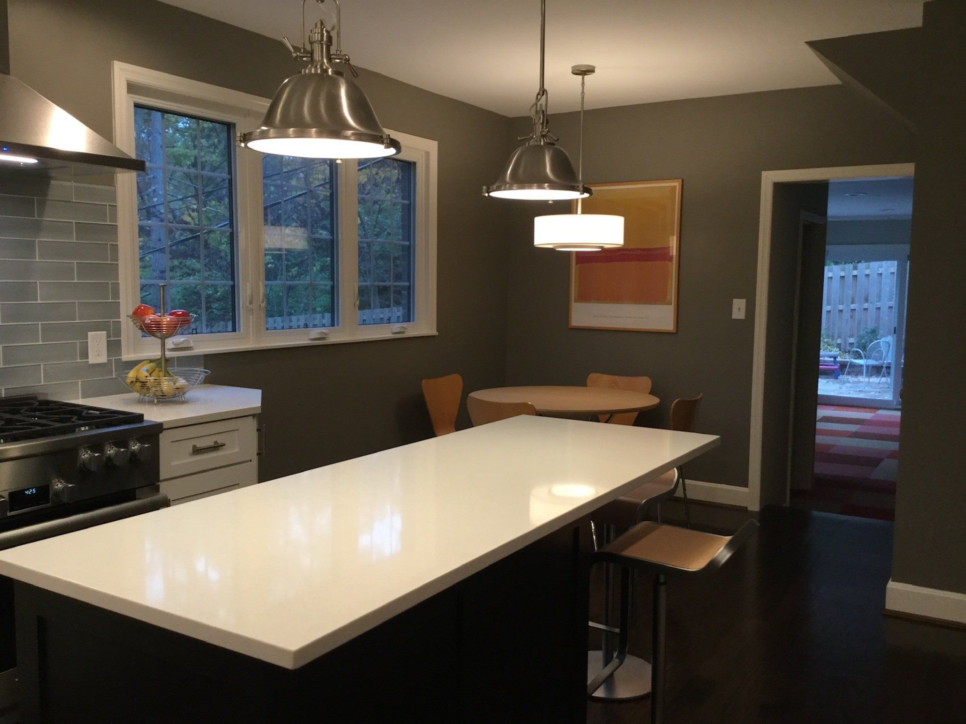 A kitchen with a large island and a table