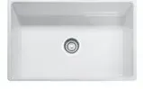 A white sink with a drain hole in the middle on a white background.