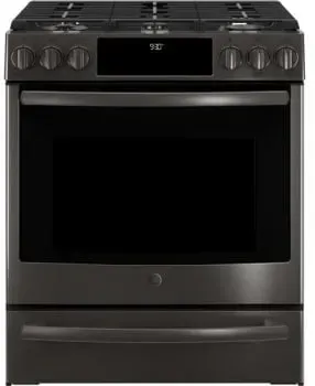 A stainless steel stove top oven with four burners and a glass door.