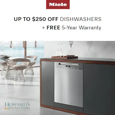A kitchen with a stainless steel dishwasher and a free 5 year warranty.