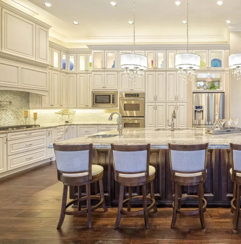 A kitchen with brown cabinets and white counter tops