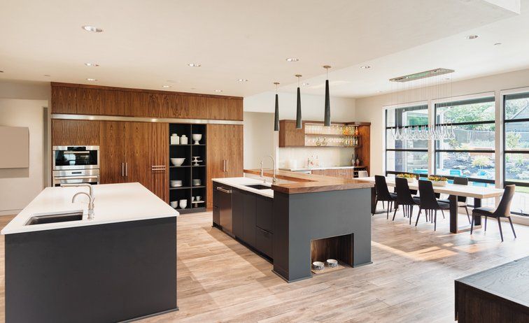 A modern kitchen with a large island in the middle of the room.