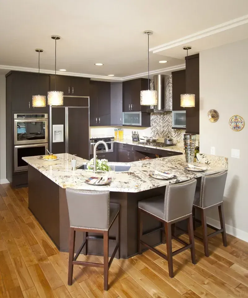 A kitchen with a large island and stools