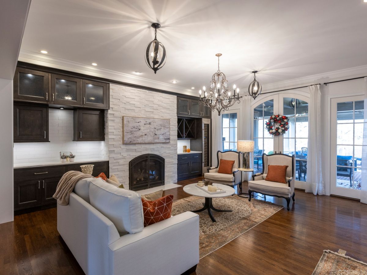 A living room filled with furniture and a fireplace.