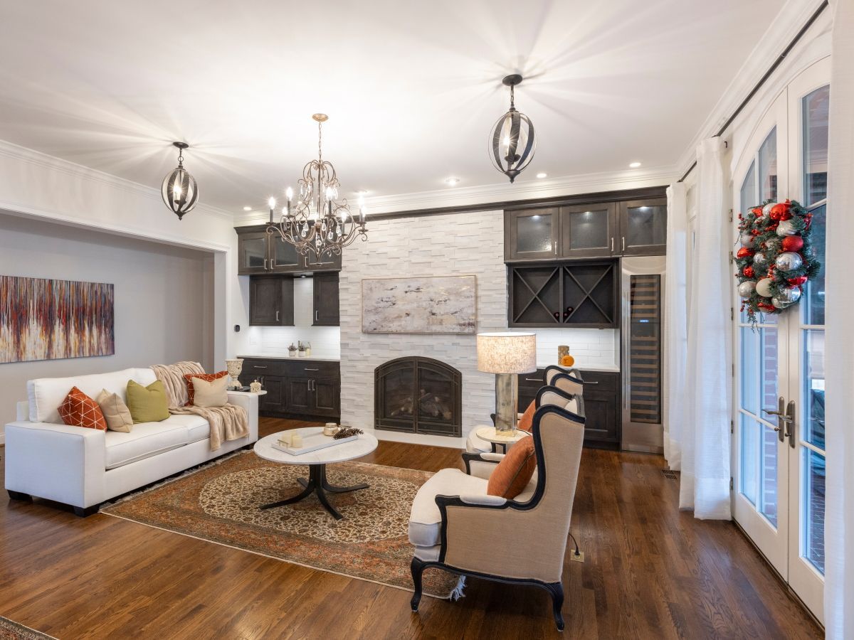 A living room filled with furniture and a fireplace.