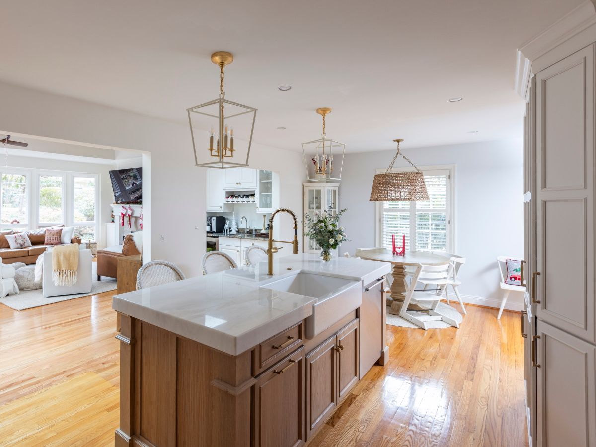 A kitchen with a large island and a sink.