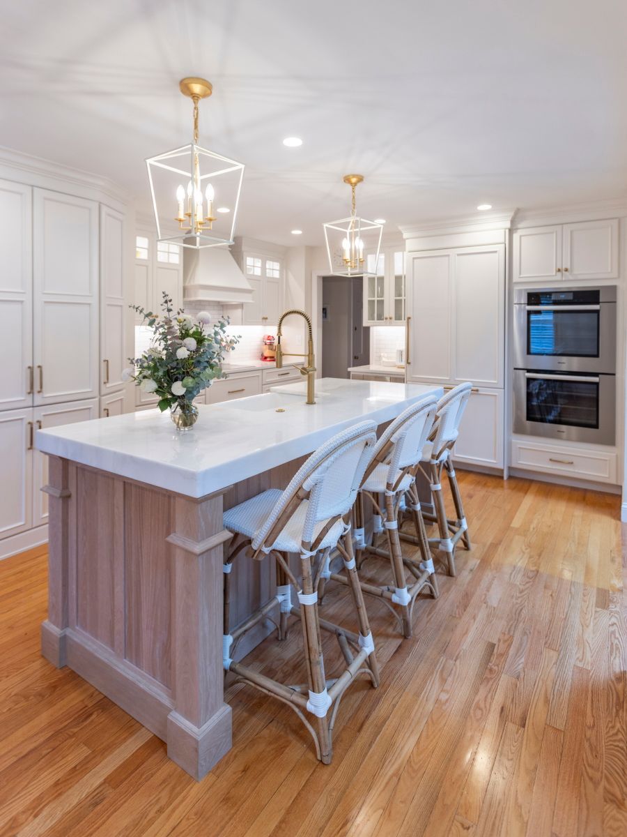 There is a large island in the middle of the kitchen.