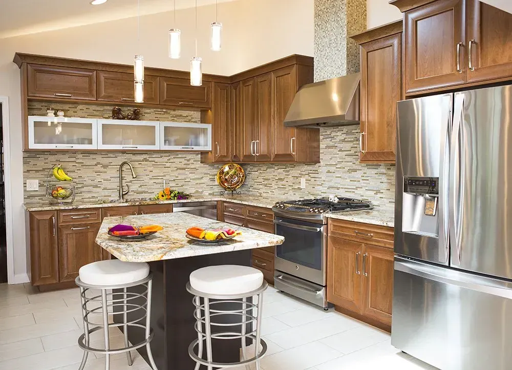 A kitchen with stainless steel appliances and wooden cabinets