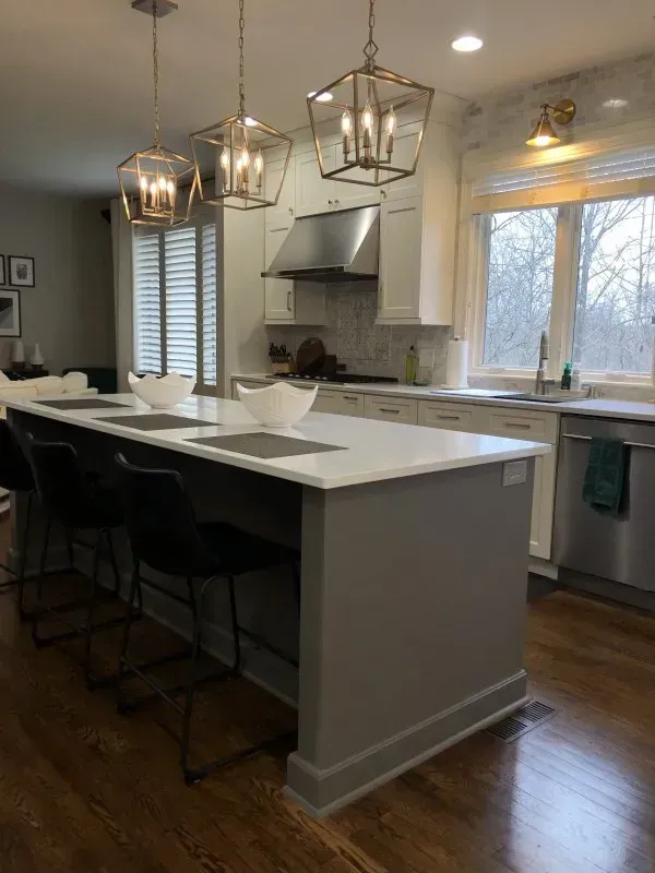 A kitchen with a large island in the middle of the room.