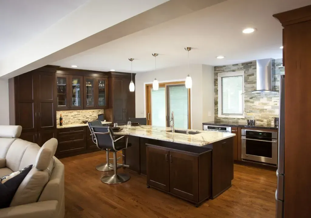 There is a large island in the middle of the kitchen.