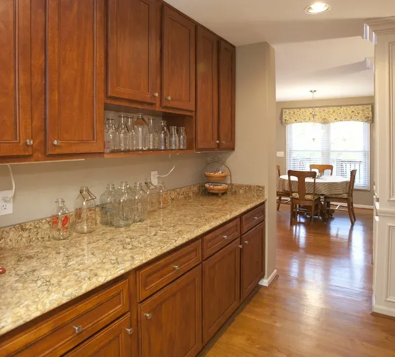 A kitchen with wooden cabinets and granite counter tops