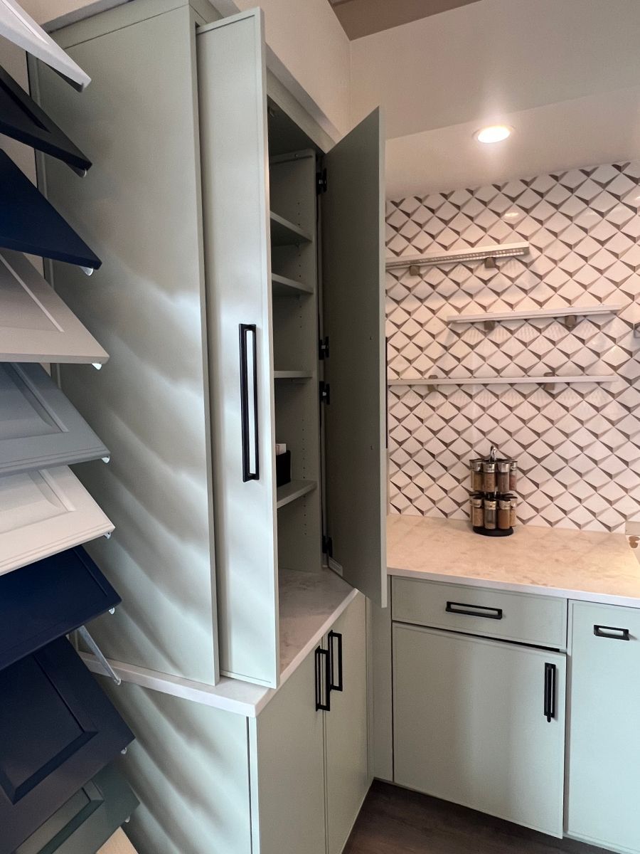 A kitchen with a lot of cabinets and shelves