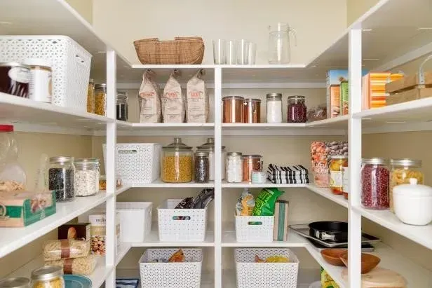 A pantry filled with lots of food and jars.