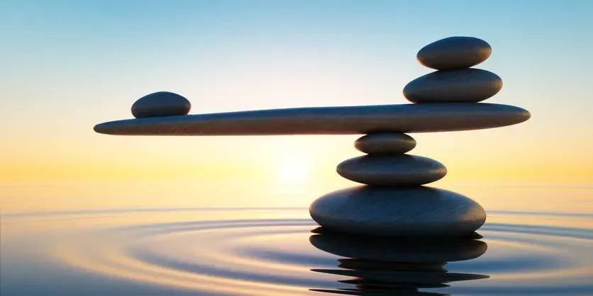 A stack of rocks sitting on top of each other in the water.