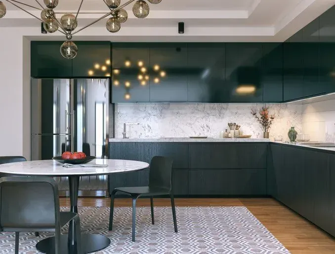 A kitchen with a table and chairs and a refrigerator.