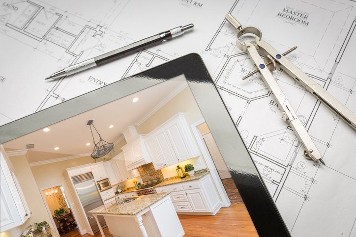 A tablet with a picture of a kitchen on it.
