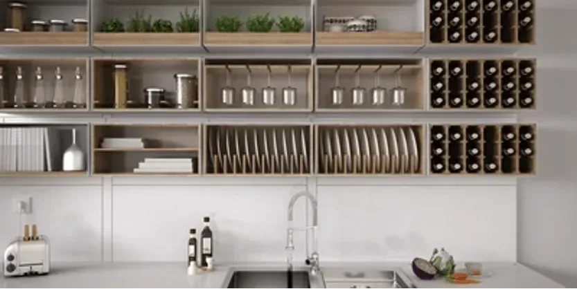 A kitchen with a sink , shelves , and a toaster oven.
