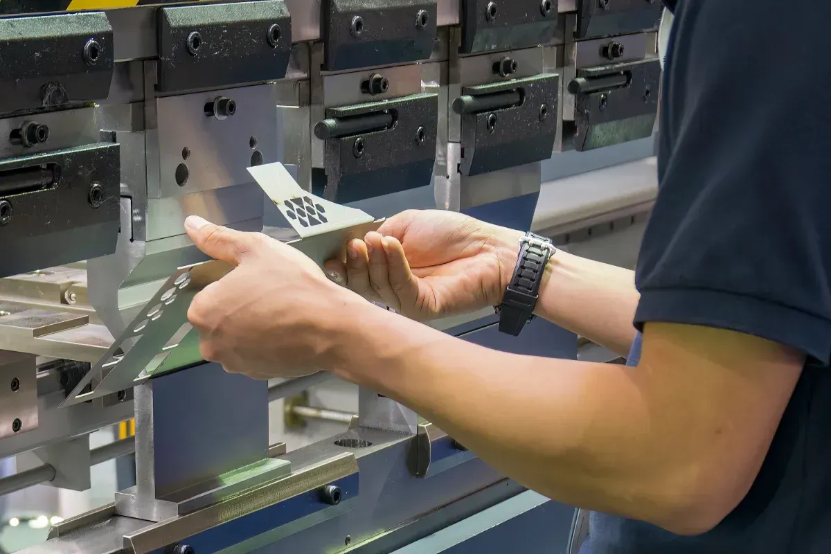 Machine Bending a Metal Pipe With Rollers — Bryants Laser Works in Ipswich, QLD