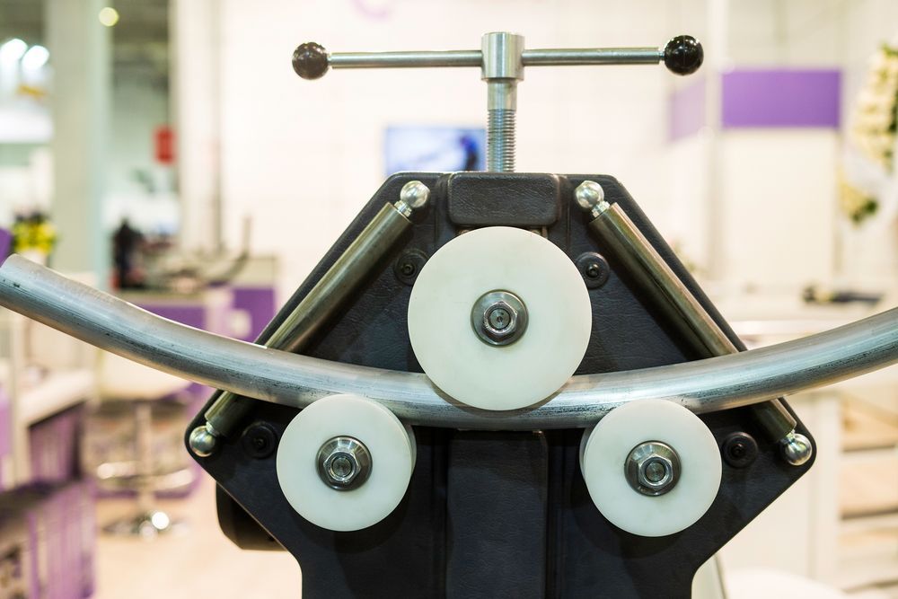Tube Bending Machine Shaping a Metal Tube — Bryants Laser Works in Brisbane, QLD