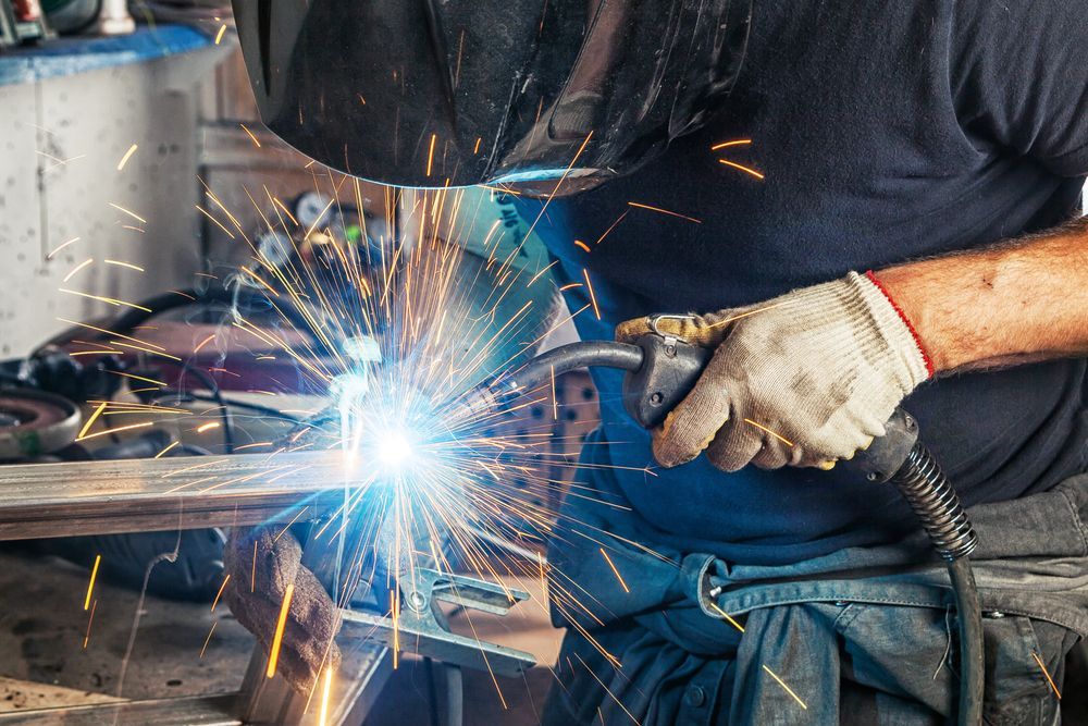 Welder Using a Welding Torch — Bryants Laser Works in Somerset & Lockyer Valley, QLD